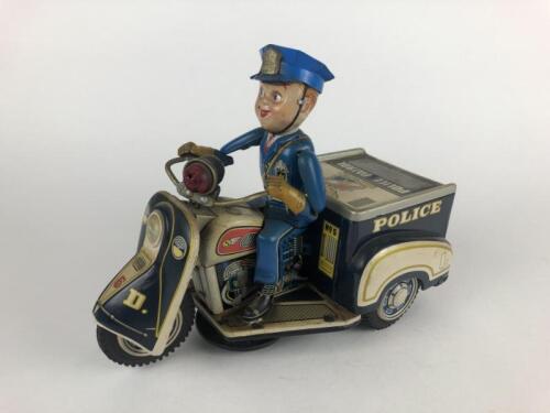 POLICE: Police Patrol Auto-Tricycle, battery operated, 25.5 cms, made by Nomura Japan mid 1960s.