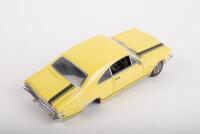 HOLDEN: A Trax 1:24 Holden Monaro&nbsp;GTS (TX-031) in yellow&nbsp;with black G.T stripes, black seats, opening features, engine detail, steerable wheels, in original protective box - 2