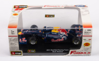 FORMULA 1: A 1:32 scale Burago Red Bull Racing F1 car model, 2011 Red Bull Renault driven by Mark Webber, in original box
