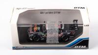 DTM: A 1:43 scale RMZ Hobby mode of a BMW M4 DTM racing car in Red Bull livery, boxed