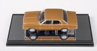 XR: A 1:43 scale Classic Carlectables Ford Falcon XR GT in gold, within acrylic case, no outer box