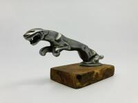 JAGUAR: A mounted 'leaper' mascot on timber base [Location: Sydney]