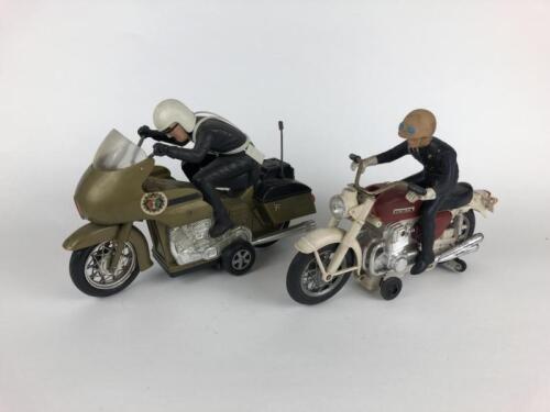 PLASTIC: Gold Police bike by Yone Japan, 29 cms plus Honda Police, 26 cms, also made in Japan, both battery powered.