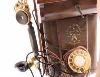 ERICSSON WALL PHONE: An early 20th Century restored antique Ericsson wall phone, oak case with sloped front, twin brass bells and dial and crank handle, with Ericsson Stockholm trademark - 2