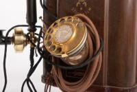 ERICSSON WALL PHONE: An early 20th Century restored antique Ericsson wall phone, oak case with sloped front, twin brass bells and dial and crank handle, with Ericsson Stockholm trademark - 3