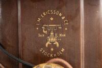 ERICSSON WALL PHONE: An early 20th Century restored antique Ericsson wall phone, oak case with sloped front, twin brass bells and dial and crank handle, with Ericsson Stockholm trademark - 4