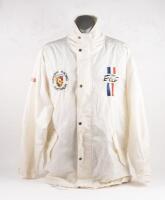 &nbsp;JACKET: A large white outer rain jacket with Porsche Historic Racing Australia detail to right chest, Team Exile to left chest, Sport Dutton cloth patch to upper right arm and Porsche Marken Weltmeister&nbsp;69-70-71 to back