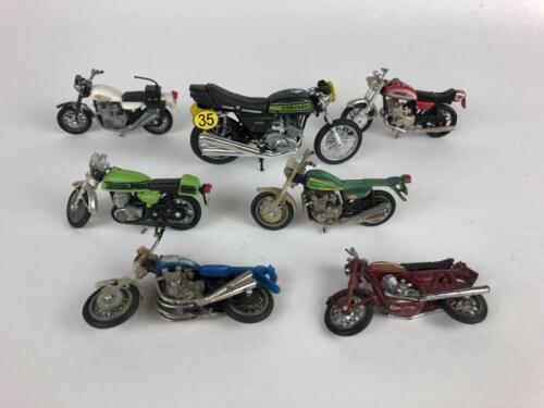 DIECAST: Seven diecast Kawasaki motor cycle models, made in Hong Kong c1970s.