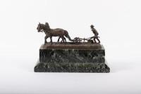 PLOWMAN: A fine late 19th / early 20th Century bronze figure of a farmer ploughing the land, this was a gift from Alan to Norman represent his thanks for Norman for sowing the seeds of Porsche for him, 28cm long