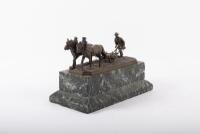 PLOWMAN: A fine late 19th / early 20th Century bronze figure of a farmer ploughing the land, this was a gift from Alan to Norman represent his thanks for Norman for sowing the seeds of Porsche for him, 28cm long - 2