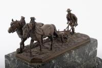 PLOWMAN: A fine late 19th / early 20th Century bronze figure of a farmer ploughing the land, this was a gift from Alan to Norman represent his thanks for Norman for sowing the seeds of Porsche for him, 28cm long - 3