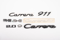 PORSCHE BADGES: A bag of assorted Porsche badges & stickers
