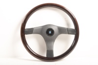 NARDI: A NOS Nardi 3 spoke partial woodgrain steering wheel