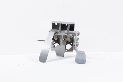 PEDAL ASSEMBLY: A Porsche 911 racing tandem master cylinder with bias bar pedal assembly, a reproduction of the original factory pedal assembly