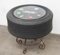 LOLA T70/SURFERS PARADISE/DON O'SULLIVAN: An original race used wheel mounted as a coffee table with glass top and applied stickers