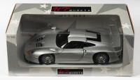 PORSCHE: A NOS 1:18 scale UT Models Porsche 911 1997 GT1 - Silver, die-cast model