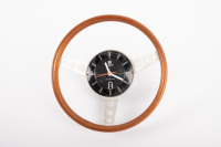 TISSOT CLOCK: A TISSOT (electronic) wood rim, three drill spoke wheel electronic clock (8cm diameter), clock to steering wheel centre, overall diameter of 19cm [Tested & Working]