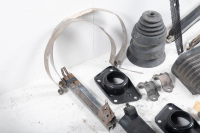 AUTOJUMBLE: A group of parts to suit 1974-85 Porsche 911, includes bumper accordions, two muffler straps, two rear torsion bar mounts, sway bar clamps, G series front bumper inserts - 4