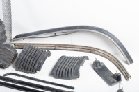 AUTOJUMBLE: A group of parts to suit 1974-85 Porsche 911, includes bumper accordions, two muffler straps, two rear torsion bar mounts, sway bar clamps, G series front bumper inserts - 5