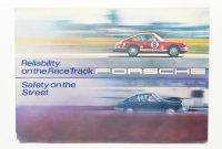 PORSCHE POSTER: A large original 1969 printed Porsche poster 'Reliability on the Race Track - Safety on the Street' with two Porsche 911 photos, one in race mode and one in road mode, 84cm high, 118cm wide