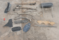 AUTOJUMBLE: A box of assorted Porsche 911 parts, includes fuel filler flaps, period engine oil lines, one headrest & steering shaft with universals