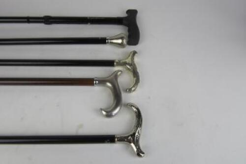 WALKING STICKS: Four traditional styled contemporary gentleman's walking sticks