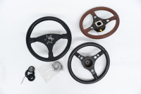 STEERING WHEELS: Three steering wheels leather bound, all have boss fitted, thought to suit 911 pre 1974