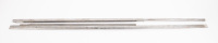 DOOR TRIMS: A pair of chrome exterior door trims to hold weather strip