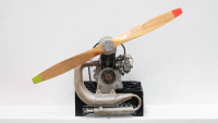 AIRCRAFT ENGINE: A Solo branded, made in Germany aircraft engine & propellor, no numbers evident, possibly two stroke & used for light aircraft such as gliders, propellor length 1.37m