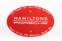 SIGN: An enamel oval shaped metal sign used by Hamilton Porsche to promote their support for the Melbourne 1996 Olympic bid, 45cm high, 30cm wide
