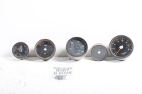 GAUGES: A set of Porsche 911 T circa 1967 gauges, includes oil temp, tacho, fuel gauge, speedo (partially dismantled) and clock
