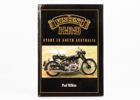 A hardcover edition of 'The Vincent H.R.D Story in South Australia' by Paul Wilkins, signed by author to title page