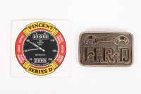Two items related to Vincent, including 'The Vincent H.R.D' belt buckle and a commemorative sticker