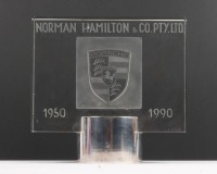 NORMAN HAMILTON: A high quality commemorative etched crystal block on cylindrical base celebrating 'Norman Hamilton & Co Pty. Ltd - 1950-1900' with etched Porsche emblem to centre, signed 'B. Hor&aacute;ček' 19cm high