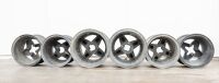 RACING WHEELS: Six four-stud lightweight wheels, believed to be magnesium McLaren style, varying sizes and widths.