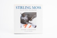 STIRLING MOSS: A hardcover edition of 'Stirling Moss - Racing with the Maestro' by Karl Ludvigsen with foreword by Phil Hill, signed by author to inside cover page