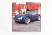 COBRA: A hardcover book titled 'Shelby Cobra - The Shelby American Original Archives 1962-1965' by Dave Friedman with foreword by Carroll Shelby