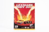 PETER BROCK: A 'Lexmark Indy 300' Gold Coast 2003 programme, signed to front cover by Peter Brock 'Enjoy Life'