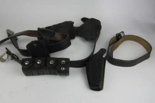FIREARMS: A collection of black cross woven leather belts and holsters