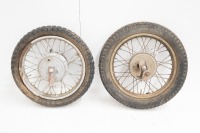 Two 16" wheels with alloy hubs, possibly Jawa