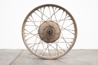 A late 1920s Indian beaded edge 18" front wheel, believed model 101, wheel turns with quill and bearings