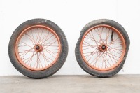 A pair of 19" sidecar wheels, possible removed from WWII jungle trolleys