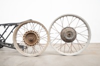 A motorcycle frame and two alloy rims believed to be CZ - 4