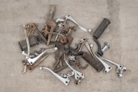 A collection of miscellaneous levers and foot pegs