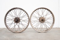 Two rear AJS 19" beaded edge wheels, both with axles and bearings, one with rusted out rim