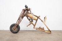 A small light weight motorcycle made up of BSA fittings and frame, has complete front end, features girder forks, possibly Triumph [Updated Description]