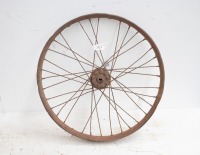 A beaded rim 23" veteran wheel, rim rusted out, bearings don't turn