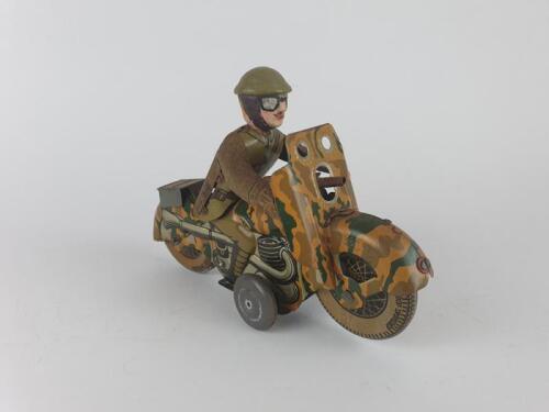 MILITARY: Military Motorcycle by Mettoy UK with flint gun, camouflaged, 19 cms, c1940s with later replacement head