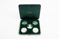 MEDALLIONS: A fine and rare boxed set of solid silver (1000) Porsche commemorative medallions that were a personal gift from Porsche Germany to Alan Hamilton we are informed by the family, boxed, (updated description: combined silver weight 100 grams)