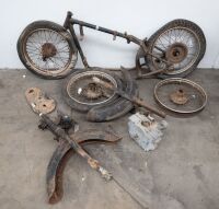 A group of Royal Enfield assorted parts, including frame, 4 wheels, two front ends, two front guards and engine cases